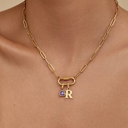 Carabiner initial birthstone necklace flat lay — Olivia Jewelry